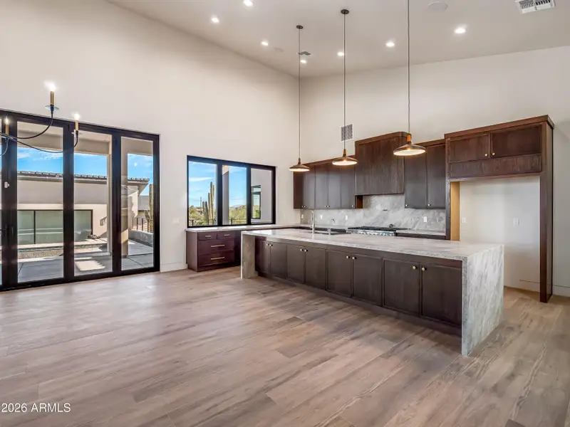Kitchen with large quartzite island Kitchen with large quartzite island