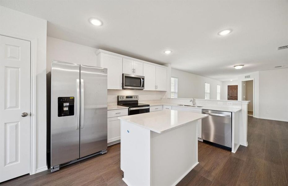 Spacious kitchen with eat-in bartop island