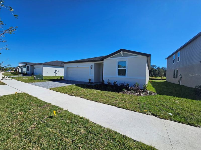 Exterior details and patio area of a home in The Reserve at Hammock Oaks - Signature Series, Lady Lake (Image 22).
