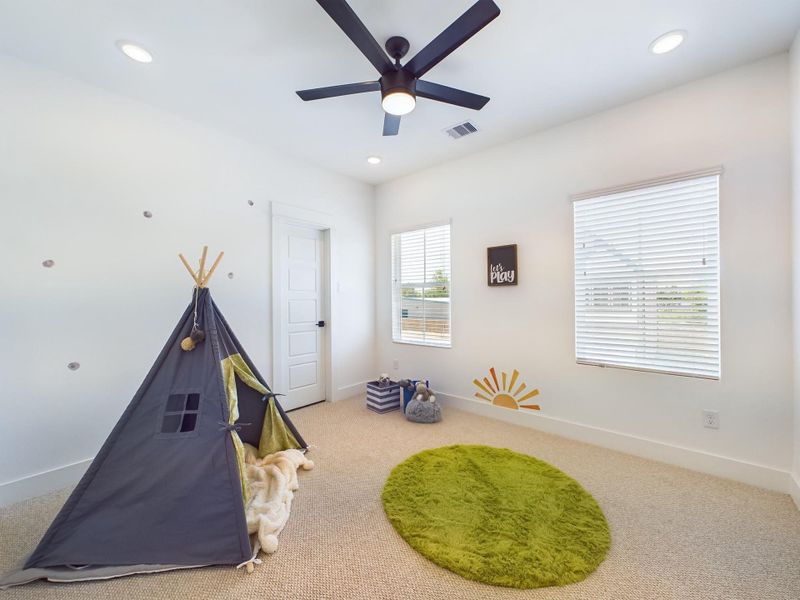 Secondary bedroom on second floor. FINISHES & FLOOR PLANS WILL VARY! Ceiling fans are not included!