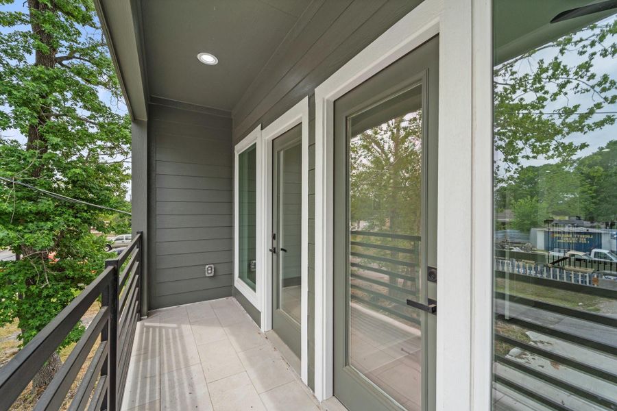 Balcony open up to the front of the home and have access from both secondary rooms Balcony open up to the front of the home and have access from both secondary rooms
