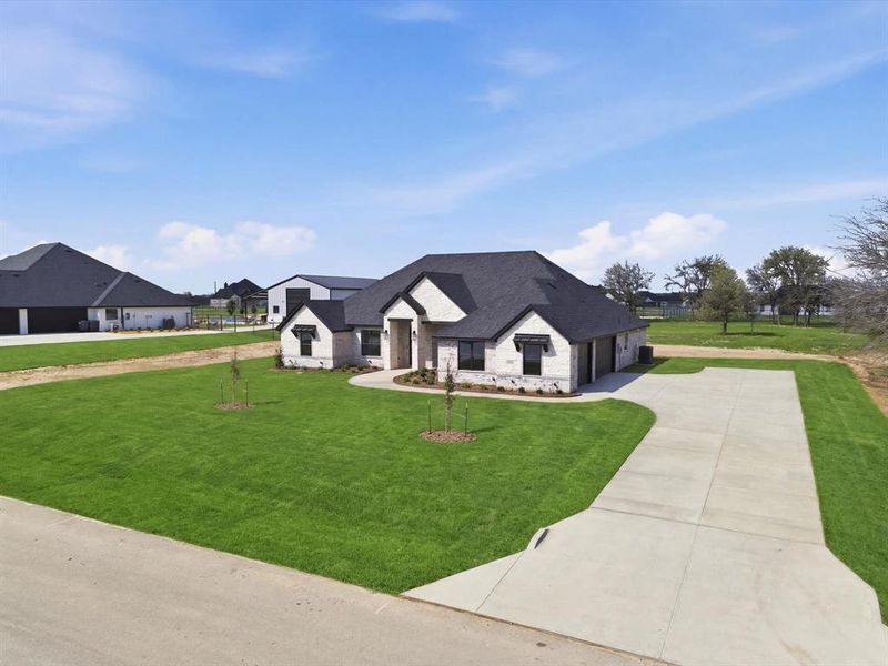 Front exterior of a new home in , Weatherford, TX, highlighting curb appeal (Image 23).