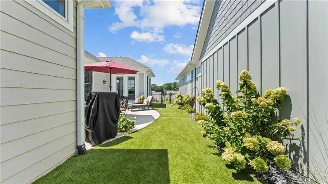 Exterior details and patio area of a home in The Courtyards at Bailey Farms, Dacula (Image 4).