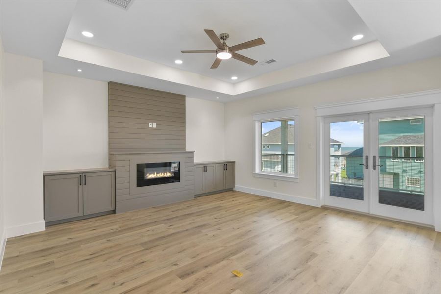 Lets start on the third floor! The open concept living room is full of natural light, a ship lapp fireplace, and a wall of windows bringing the views of the beach indoors. Lets start on the third floor! The open concept living room is full of natural light, a ship lapp fireplace, and a wall of windows bringing the views of the beach indoors.