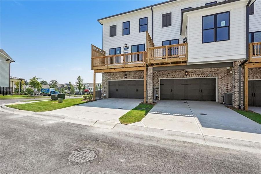 Front exterior of a new home in Millcroft Townhomes, Buford, GA, highlighting curb appeal (Image 34). Front exterior of a new home in Millcroft Townhomes, Buford, GA, highlighting curb appeal (Image 34).