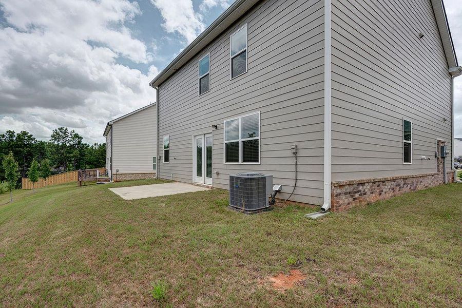 Exterior details and patio area of a home in Cedar Ridge - Locust Grove Station, Locust Grove (Image 3).