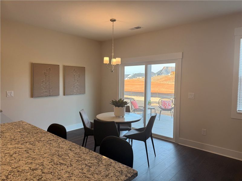This inviting dining area features elegant floorin