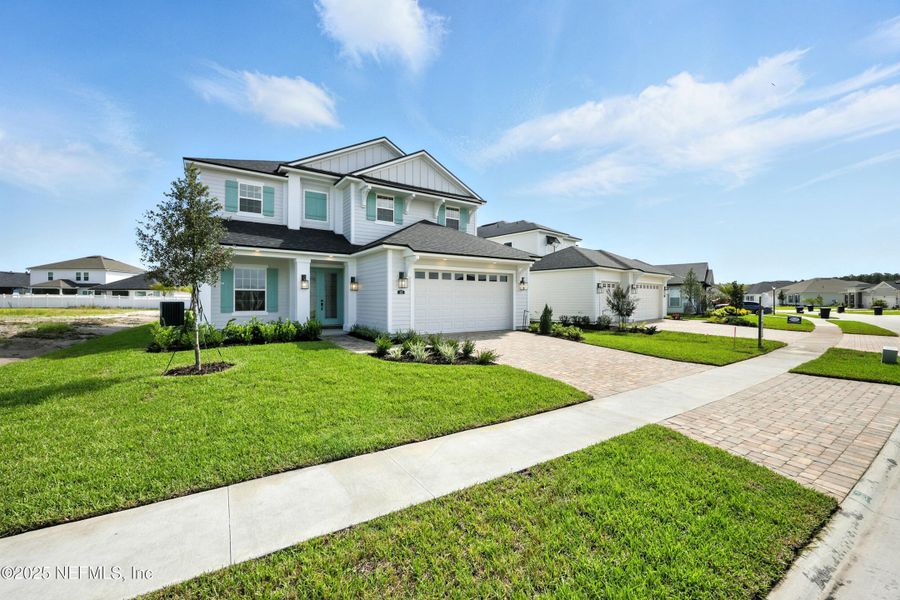 Front exterior of a new home in Silver Landing At Silverleaf, St. Augustine, FL, highlighting curb appeal (Image 25).