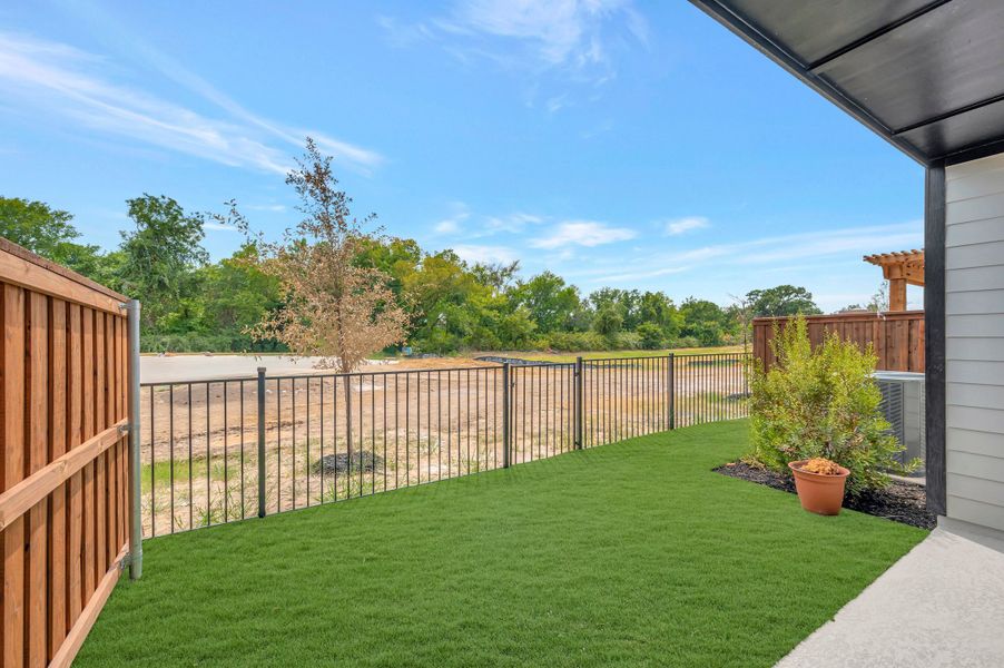 Exterior details and patio area of a home in Trails at Waterside - Villas Series, Fort Worth (Image 3).