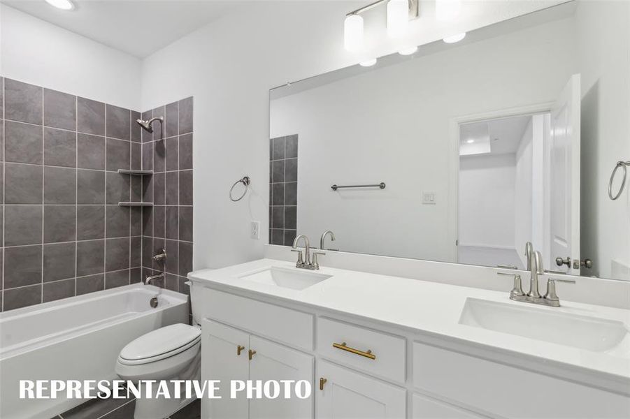 Friends and family will appreciate having their own vanity space in this thoughtfully designed guest bath.