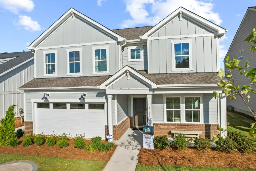 Front exterior of a new home in The Retreat at Carolina Ridge, Harrisburg, NC, highlighting curb appeal (Image 21). Front exterior of a new home in The Retreat at Carolina Ridge, Harrisburg, NC, highlighting curb appeal (Image 21).