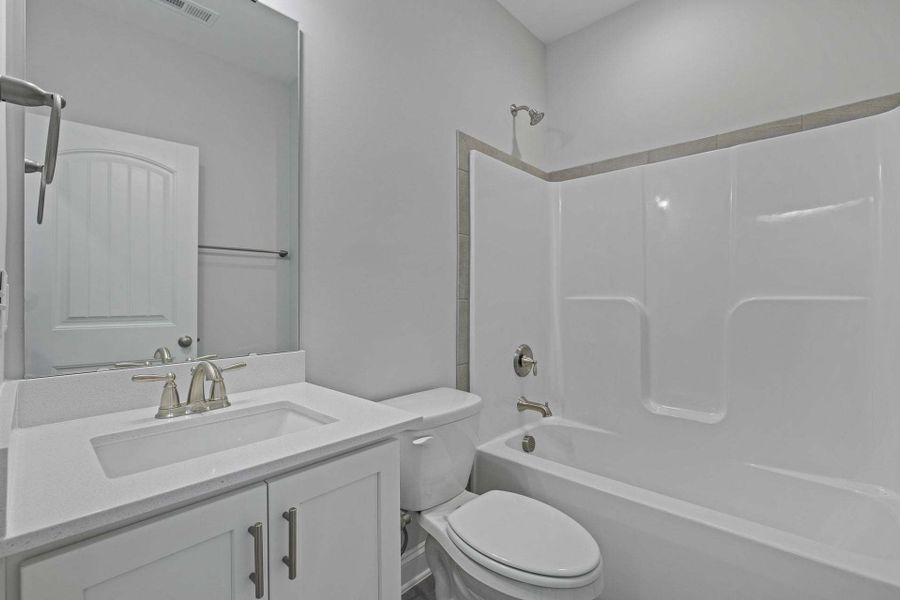 Representative furnished interior of a home built from the Garland by Caviness & Cates Communities in Bartlett Manor, Youngsville (Image 246). Representative furnished interior of a home built from the Garland by Caviness & Cates Communities in Bartlett Manor, Youngsville (Image 246).