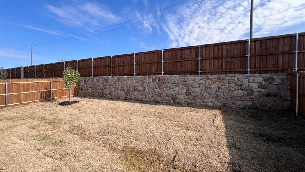 Exterior details and patio area of a home in Bluestem, Rhome (Image 3). Exterior details and patio area of a home in Bluestem, Rhome (Image 3).