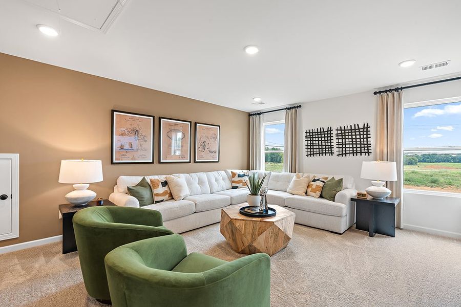 A living room with green couches. A living room with green couches.