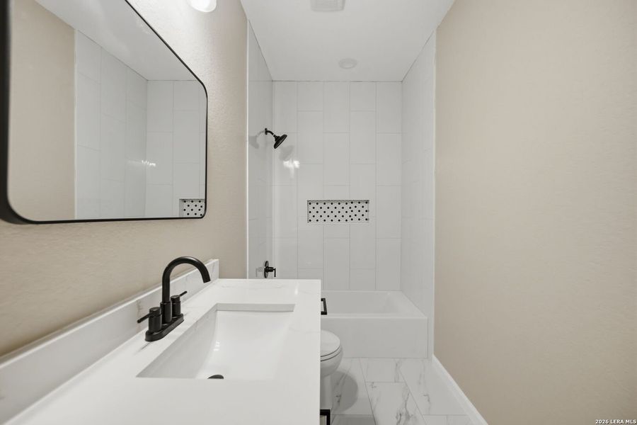 Furnished interior view inside a new home in , Devine (Image 10).