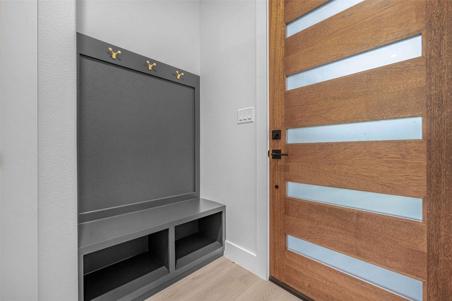 Mudroom featuring wood-finished flooring. Mudroom featuring wood-finished flooring.