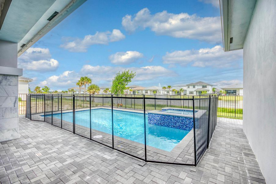 Front exterior of a new home in Apex at Avenir, Palm Beach Gardens, FL, highlighting curb appeal (Image 24).