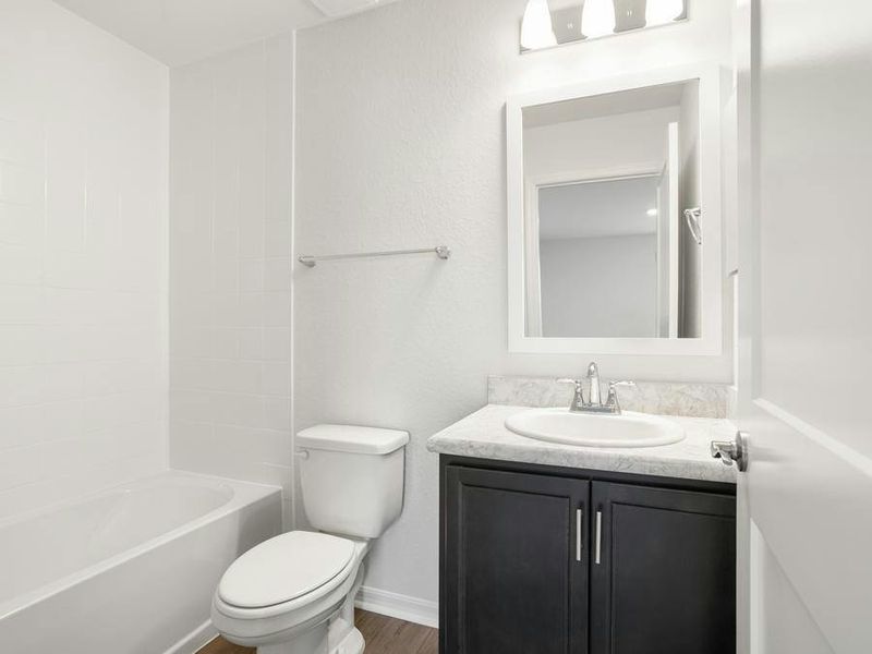 And, an upstairs hall bath serves bedroom 4 and the loft.