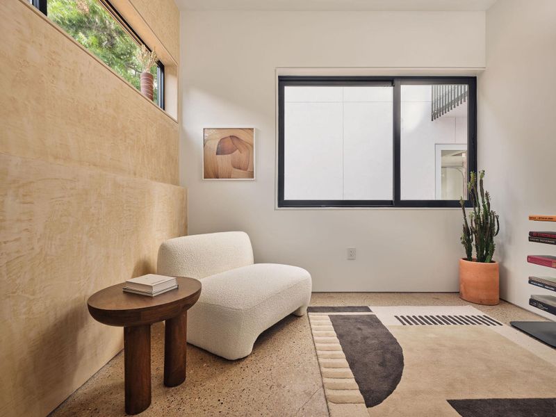 Living area featuring speckled floor Living area featuring speckled floor