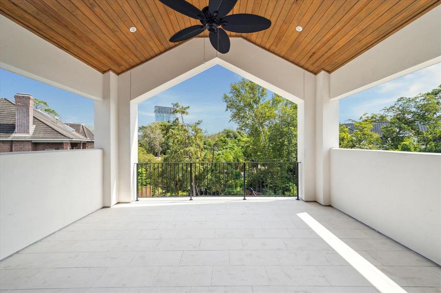 This private primary suite terrace offers breathtaking views of the lush natural landscape, making it the perfect spot to enjoy serene sunrises with a cup of coffee. Two sets of Durango doors provide seamless access to the bedroom, blending indoor comfort with outdoor beauty.