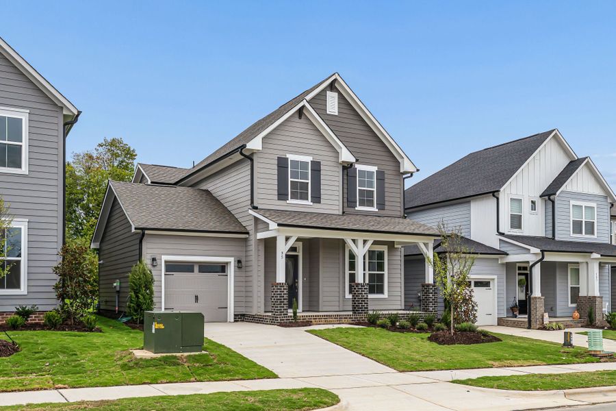 Front exterior of a new home in Serenity - The Cottage Collection, Fuquay Varina, NC, highlighting curb appeal (Image 22).