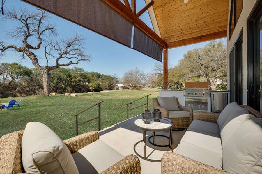 View of patio featuring area for grilling and an outdoor hangout area