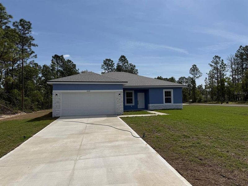 Front exterior of a new home in , Ocala, FL, highlighting curb appeal (Image 13).