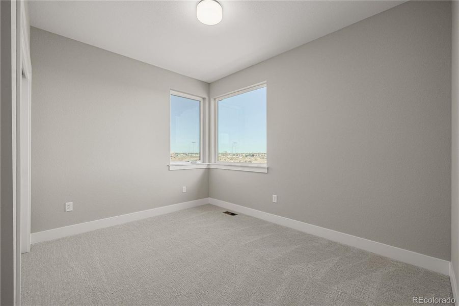 Spacious, unfurnished interior of a new home in West Grange, Longmont (Image 33).