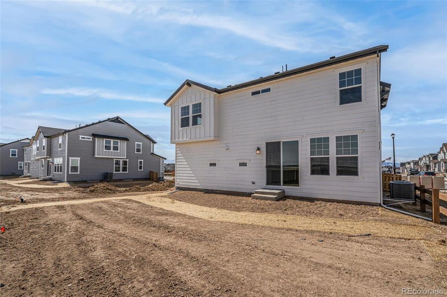 Front exterior of a new home in , Commerce City, CO, highlighting curb appeal (Image 22).