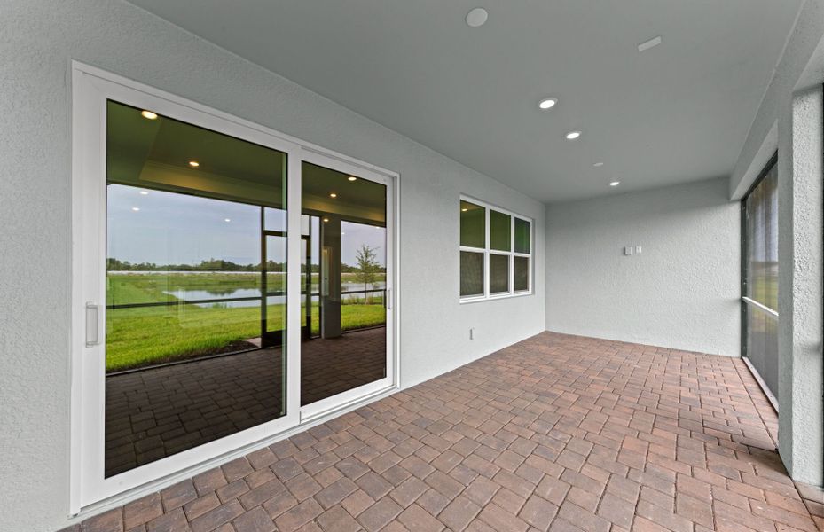 Exterior details and patio area of a home in Shores at Stillwater, Englewood (Image 4).