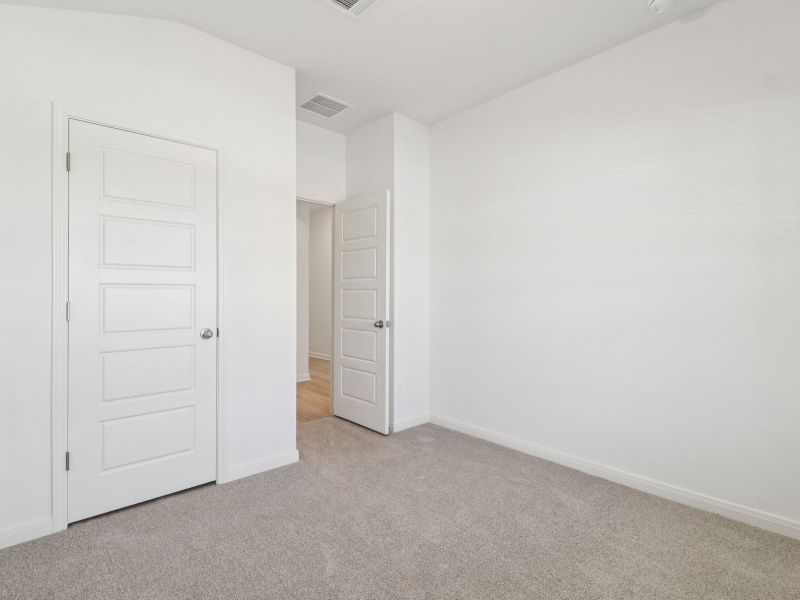 Guest bedroom in the Callaghan floorplan at a Meritage Homes community. Guest bedroom in the Callaghan floorplan at a Meritage Homes community.