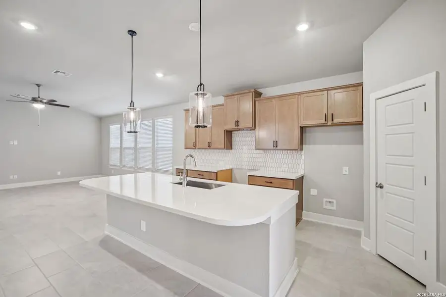 Furnished interior view inside a new home in Estancia Ranch - Premier Series, San Antonio (Image 13).