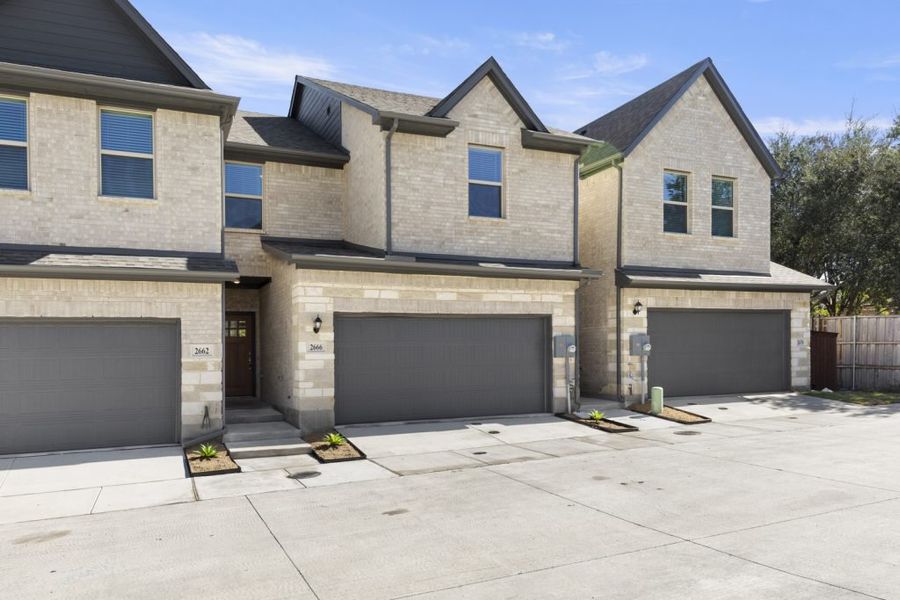 Front exterior of a new home in Sereno Oaks at Buckner Terrace, Dallas, TX, highlighting curb appeal (Image 2). Front exterior of a new home in Sereno Oaks at Buckner Terrace, Dallas, TX, highlighting curb appeal (Image 2).