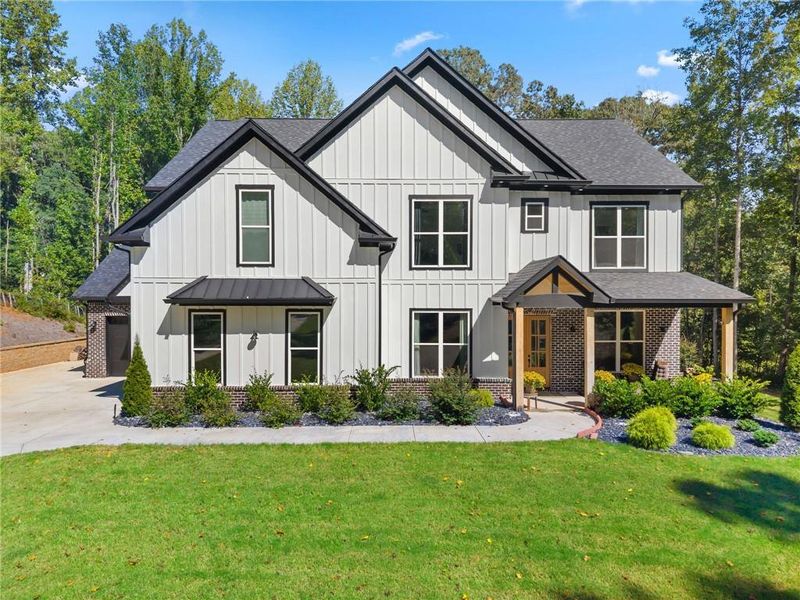 Front exterior of a new home in , Hoschton, GA, highlighting curb appeal (Image 21). Front exterior of a new home in , Hoschton, GA, highlighting curb appeal (Image 21).