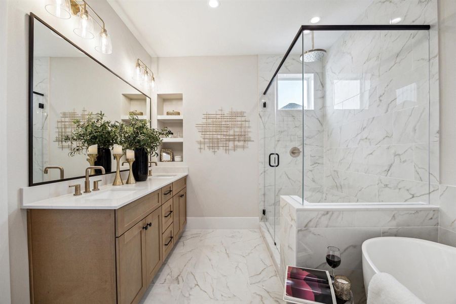 Primary features spa-like bathroom with dual sinks, large soak-in tub and spacious walk-in shower