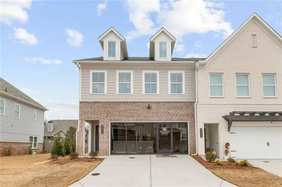 Front exterior of a new home in Wilkins Walk, Mableton, GA, highlighting curb appeal (Image 1). Front exterior of a new home in Wilkins Walk, Mableton, GA, highlighting curb appeal (Image 1).