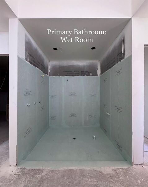 Luxurious spa-inspired Wet Room with Dual Shower-heads and space for a Freestanding Soaking Tub, creating a serene retreat within the primary suite.
