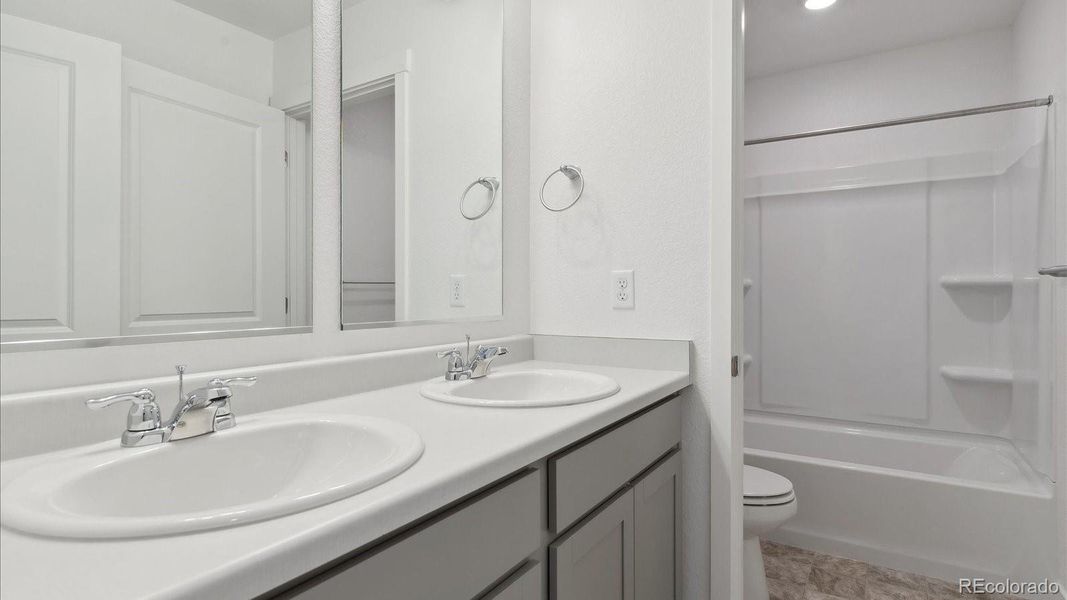 Furnished interior view inside a new home in Silver Peaks, Lochbuie (Image 5).