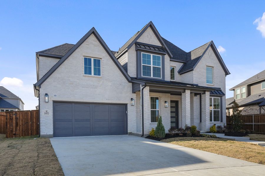 Front exterior of a new home in Estates at Rockhill, Frisco, TX, highlighting curb appeal (Image 2). Front exterior of a new home in Estates at Rockhill, Frisco, TX, highlighting curb appeal (Image 2).