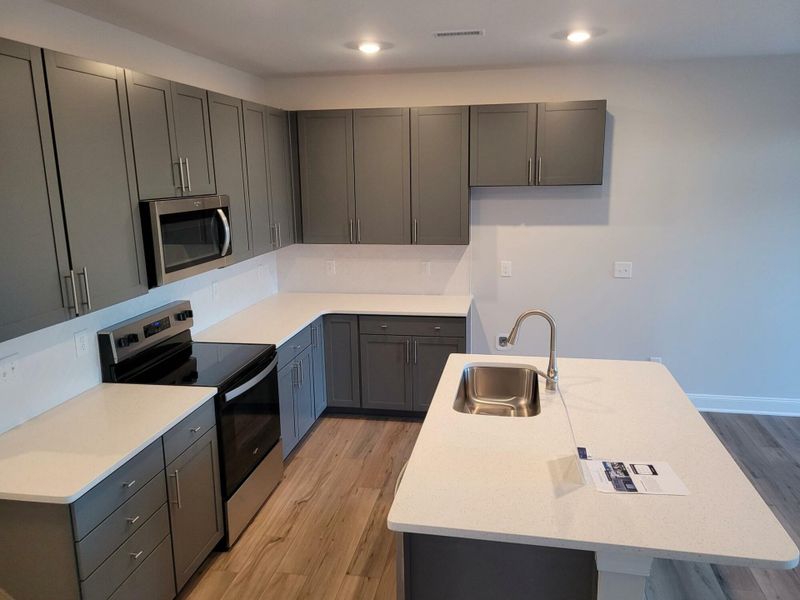Furnished interior view inside a new home in 1158 Place Townhomes, Wilson (Image 6).