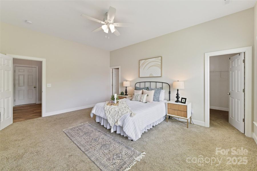 Primary Suite with ceiling fan/light, private bath, walk in closet & large windows for prefect lake views!