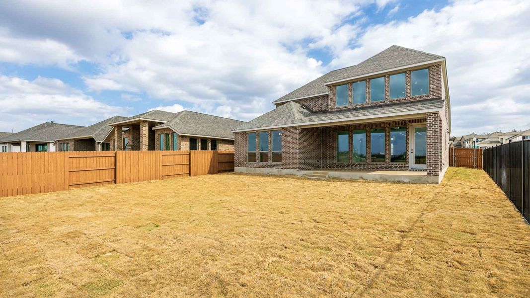 Exterior details and patio area of a home in The Colony, Bastrop (Image 2).