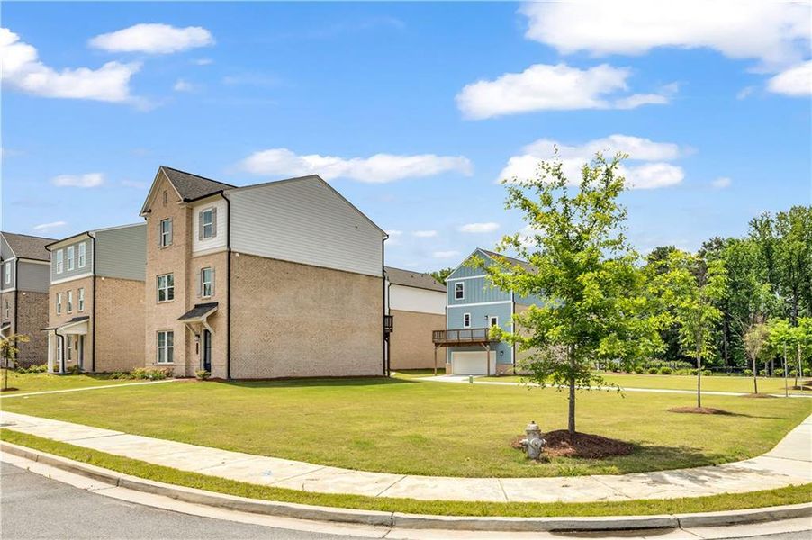 Front exterior of a new home in , Lawrenceville, GA, highlighting curb appeal (Image 27).