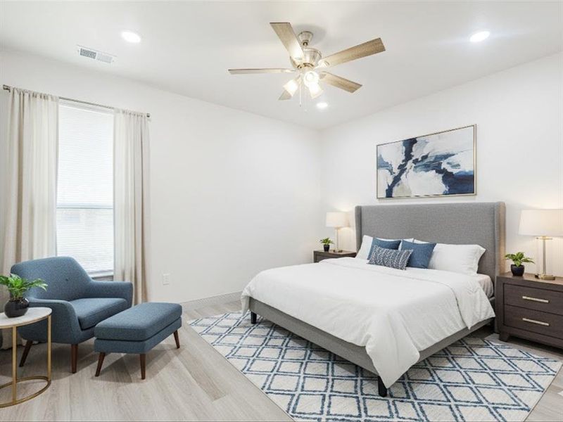 Bedroom featuring light wood-style floors, a ceiling fan, and recessed lighting