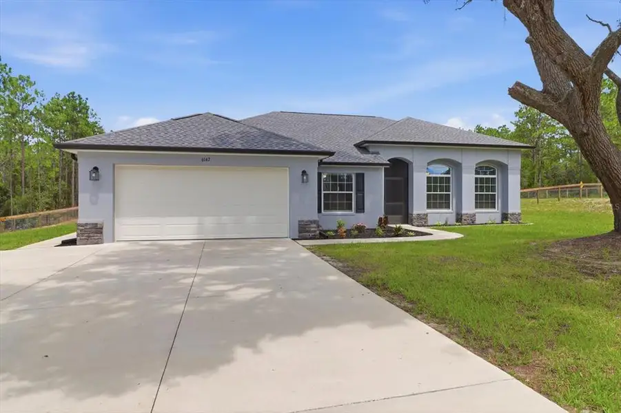 Front exterior of a new home in , Beverly Hills, FL, highlighting curb appeal (Image 1). Front exterior of a new home in , Beverly Hills, FL, highlighting curb appeal (Image 1).