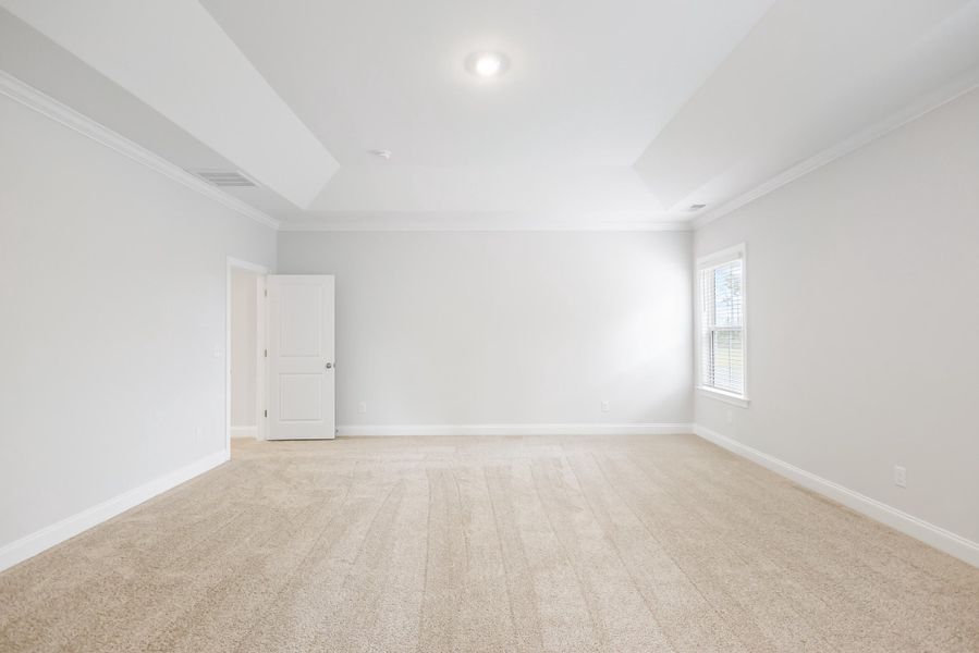 Spacious, unfurnished interior of a new home in Tidewater at Lakes of Cane Bay, Summerville (Image 54).