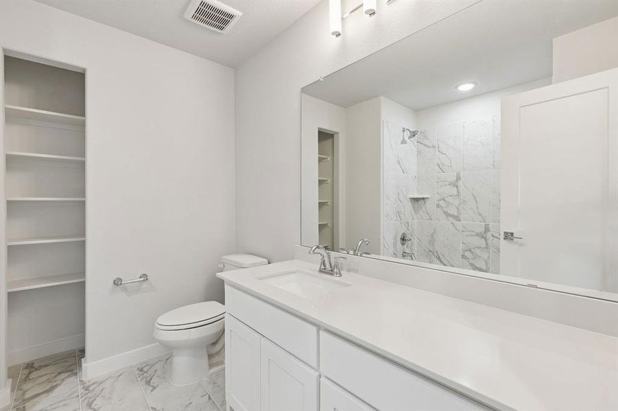 Bathroom in the Stanley II home plan by Trophy Signature Homes – REPRESENTATIVE PHOTO