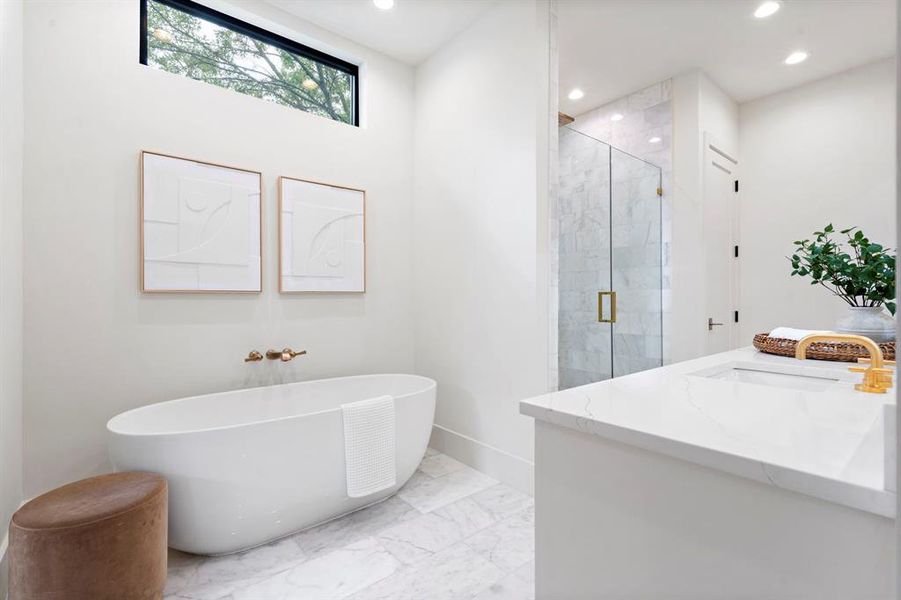 Full bathroom featuring a soaking tub, a shower stall, recessed lighting, marble finish floors, and vanity Full bathroom featuring a soaking tub, a shower stall, recessed lighting, marble finish floors, and vanity
