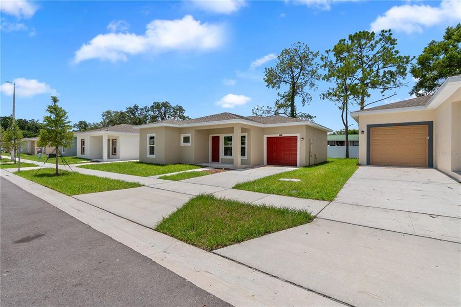 Front exterior of a new home in , Tampa, FL, highlighting curb appeal (Image 25). Front exterior of a new home in , Tampa, FL, highlighting curb appeal (Image 25).