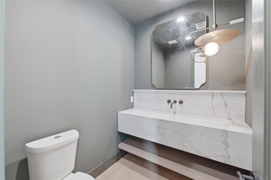 Every detail is thoughtfully designed—including this elegant powder bath that adds style and convenience for guests.